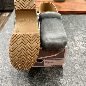 Dansko blue natural leather clogs. Worn once around the house.